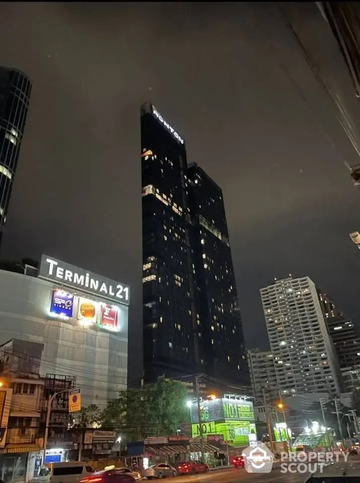 Stunning night view of modern high-rise buildings near Terminal 21, showcasing urban living.