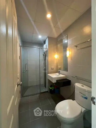 Modern bathroom with glass shower and sleek fixtures