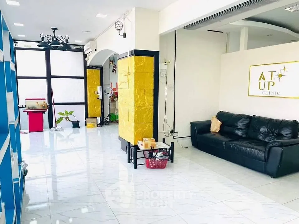 Spacious modern clinic interior with sleek design and comfortable seating area.