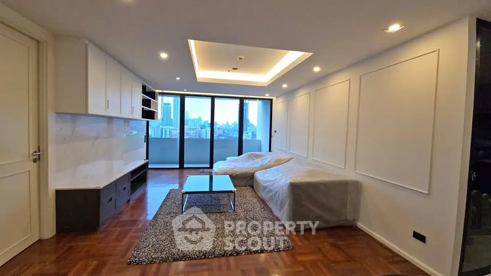 Spacious modern living room with city view and large balcony access