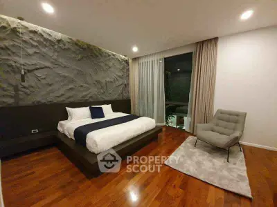 Luxurious modern bedroom with elegant decor and wooden flooring