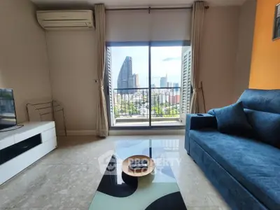 Modern living room with city view, featuring sleek furniture and large windows for natural light.