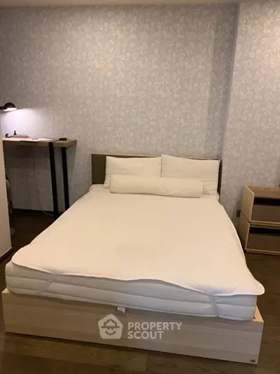 Cozy bedroom with modern decor and comfortable bed in stylish apartment.