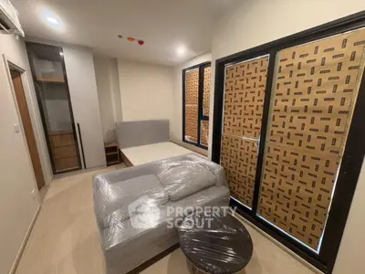 Modern apartment interior with large windows and stylish furniture
