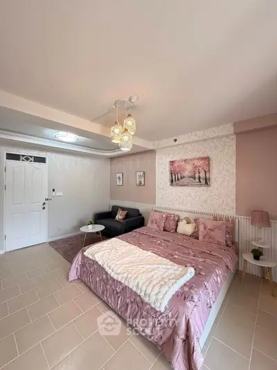 Charming bedroom with cozy decor and elegant lighting in a modern apartment.