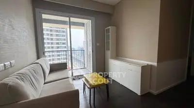 Modern living room with balcony view in urban apartment