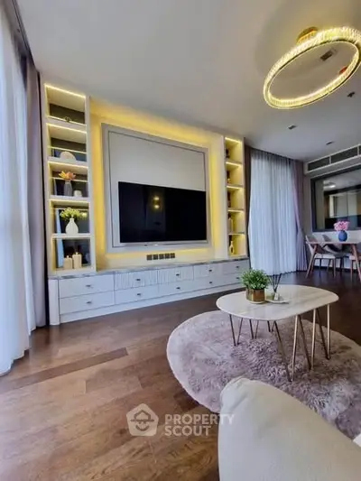 Luxurious living room with modern decor, elegant lighting, and stylish furniture in a contemporary apartment.