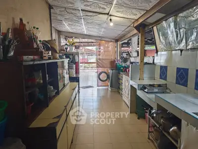 Charming rustic kitchen with open layout and vintage decor, featuring tiled walls and ample storage space.