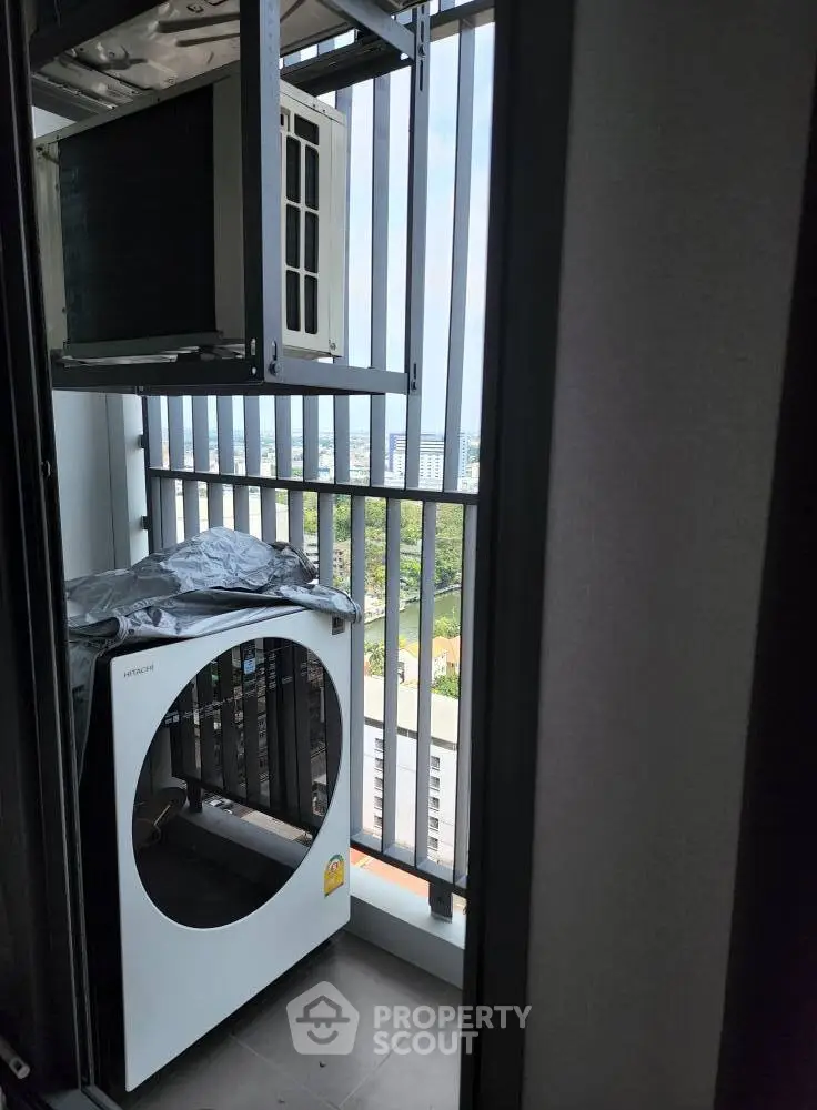 Modern balcony with washing machine and air conditioning unit, offering a practical urban living solution.