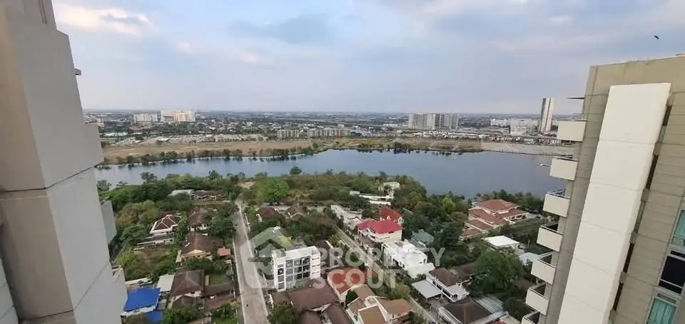 Stunning high-rise view of cityscape and river from balcony