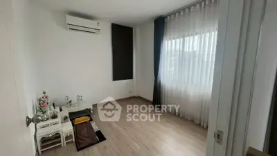 Minimalist room with air conditioning and large window, perfect for a serene living space.