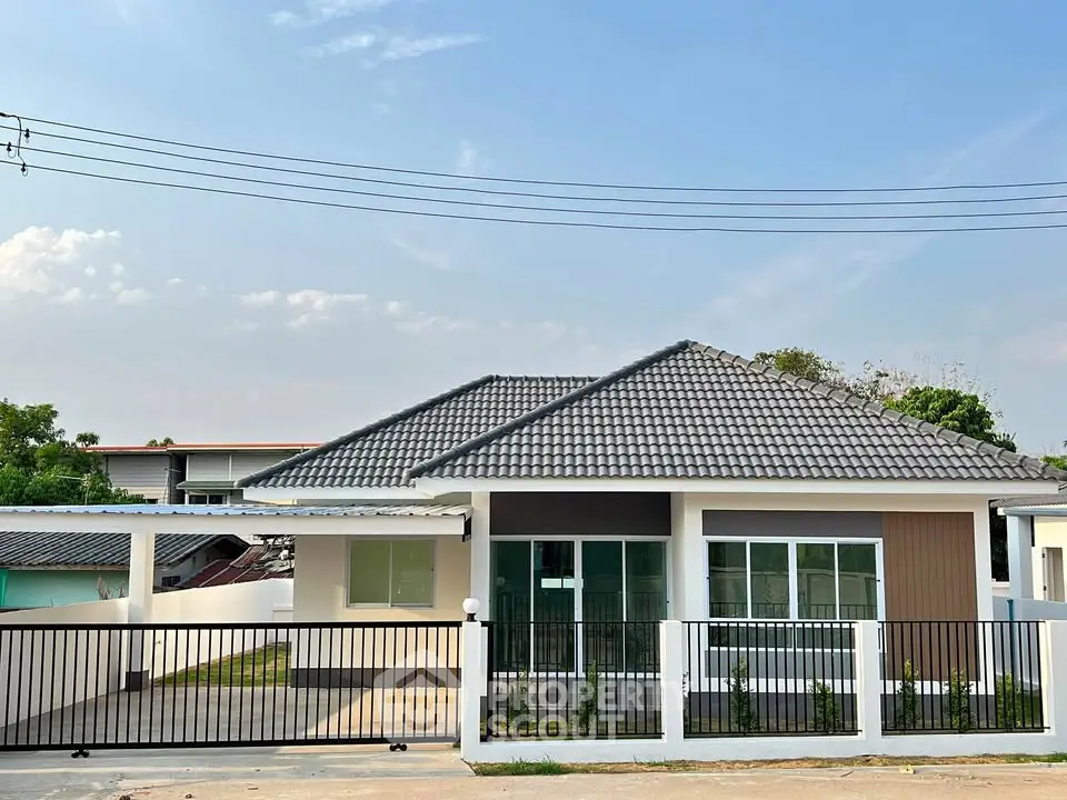 Charming single-story house with modern design and spacious front yard