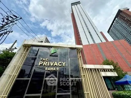 Modern high-rise building with sleek architecture at The Privacy Rama 9.