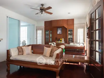 Spacious living room with elegant wooden furniture and natural light