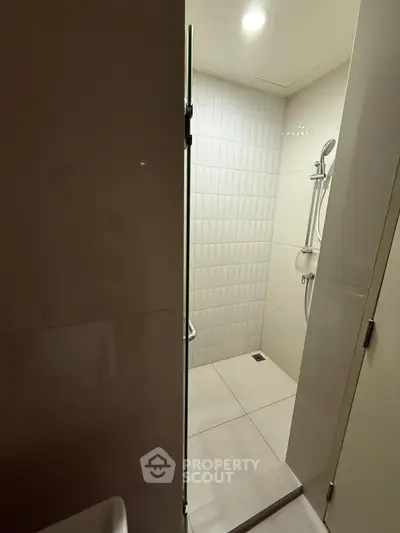 Modern bathroom with sleek shower design and contemporary tiles
