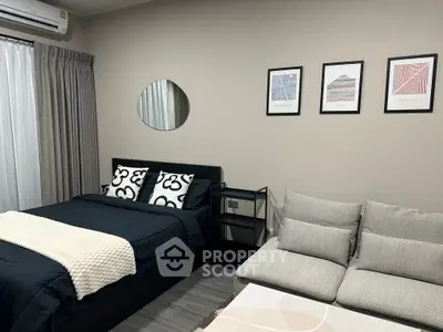 Modern bedroom with stylish decor and cozy seating area