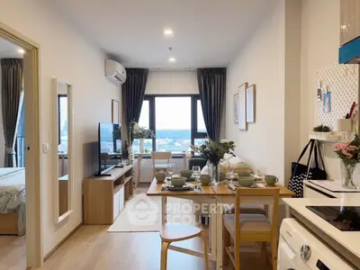 Modern open-plan living room with dining area and city view