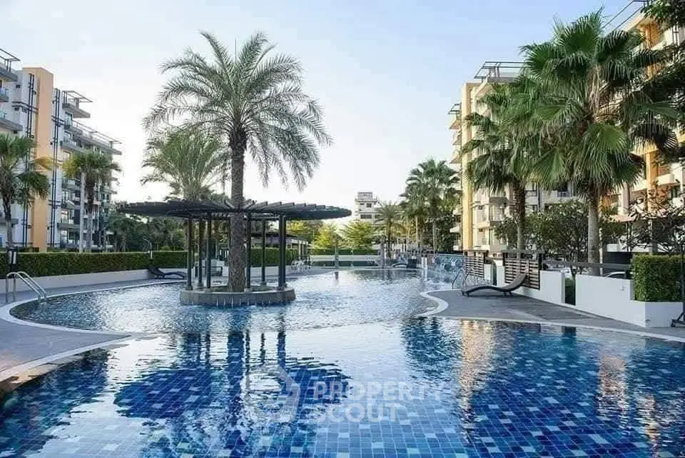 Luxurious residential complex with stunning pool and lush palm trees