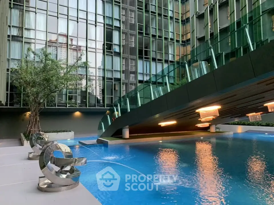 Luxurious modern apartment pool area with sleek design and stunning architecture.