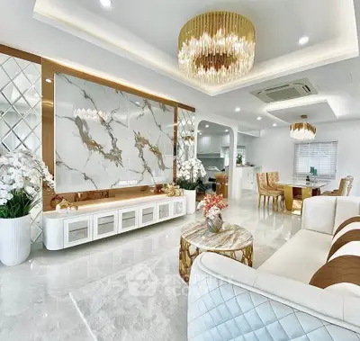 Luxurious open-plan living room with elegant decor and modern lighting