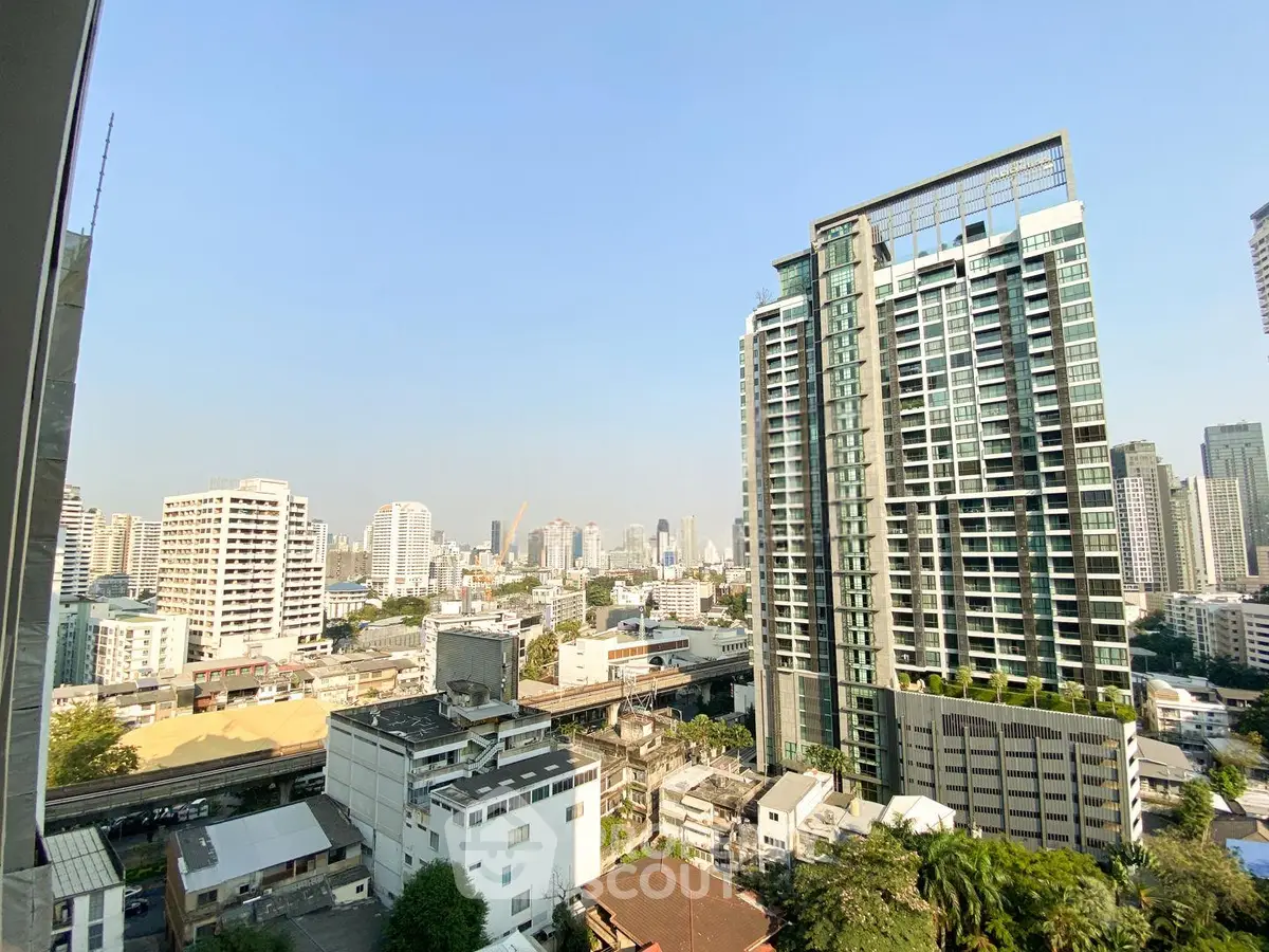 Stunning cityscape view from high-rise building showcasing urban skyline and modern architecture.