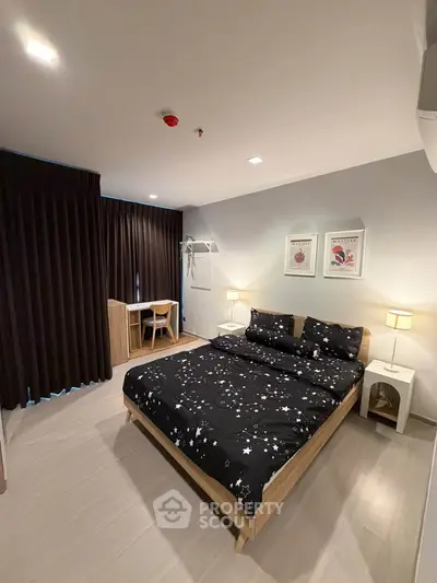 Modern bedroom with stylish decor and cozy ambiance, featuring a comfortable bed and elegant furnishings.
