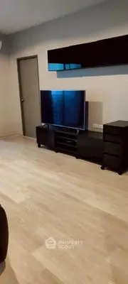 Modern living room with sleek TV setup and minimalist decor