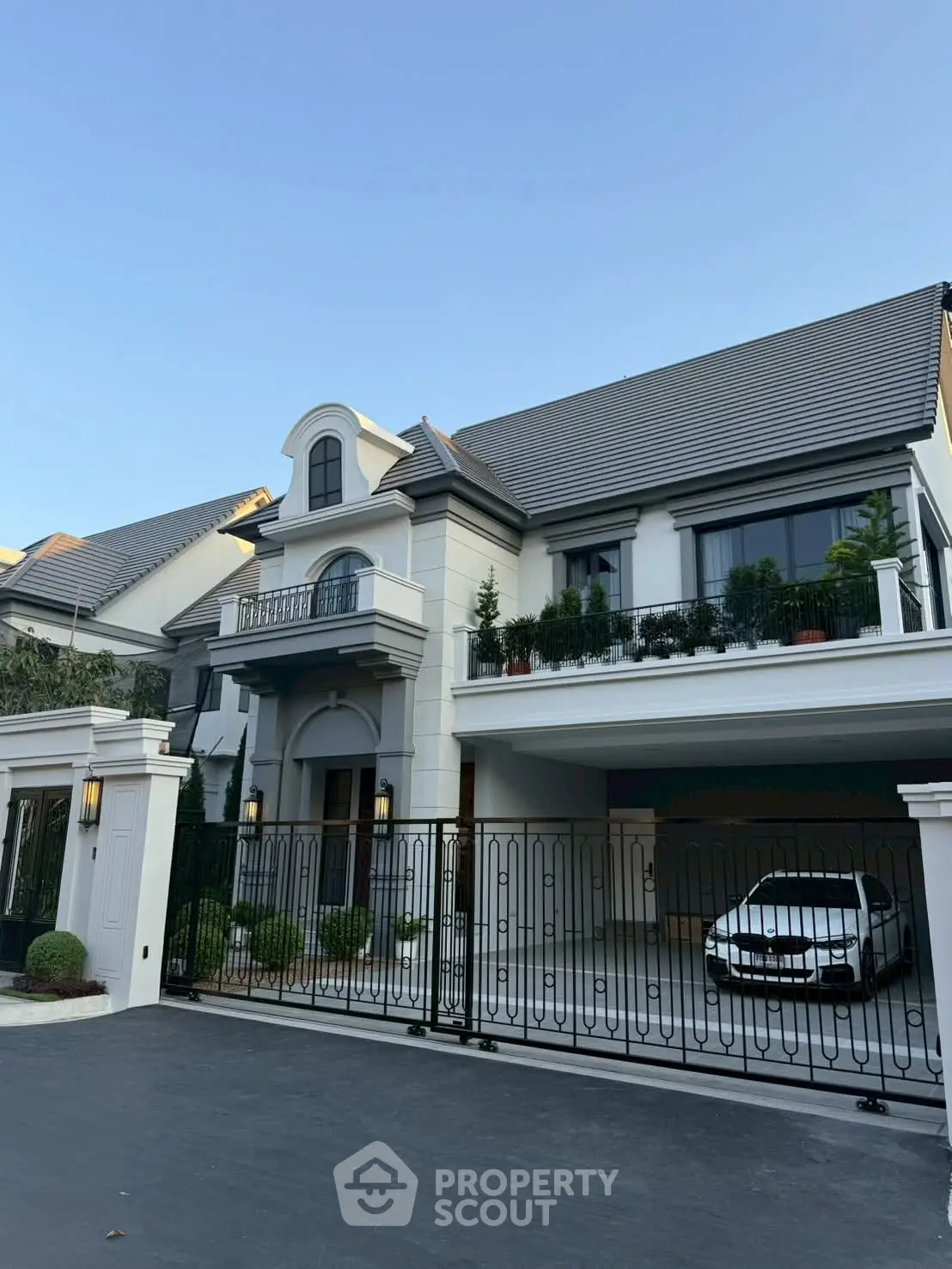 Luxurious modern house with elegant facade and spacious driveway