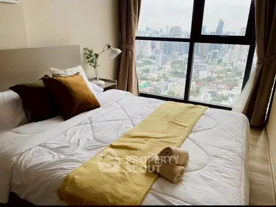 Luxurious bedroom with stunning city view and elegant decor