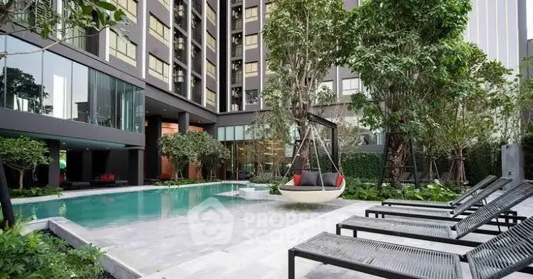 Luxurious modern apartment complex with pool and lush greenery