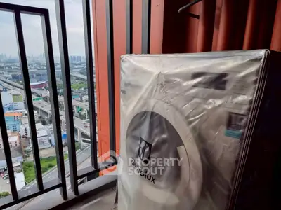 High-rise balcony with city view and Electrolux appliance