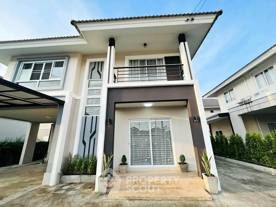 Modern two-story house with elegant facade and spacious driveway