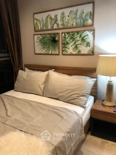 Cozy bedroom with stylish decor and warm lighting, perfect for relaxation.