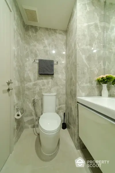 Modern bathroom with elegant marble tiles and sleek fixtures