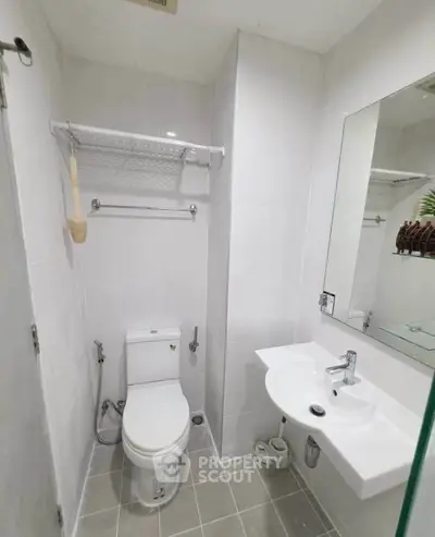Modern bathroom with sleek fixtures and minimalist design in a contemporary apartment.