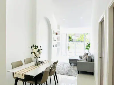 Bright and modern living room with dining area and stylish decor