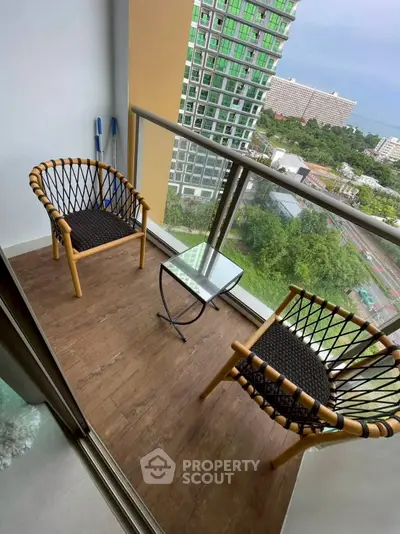 Charming balcony with modern seating and scenic view in urban high-rise