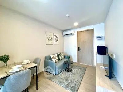 Modern living room with cozy seating and stylish decor in a contemporary apartment.