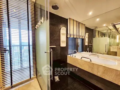 Luxurious bathroom with modern bathtub and city view, perfect for relaxation and comfort.
