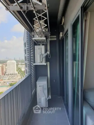 Modern high-rise balcony with city view and air conditioning units, perfect for urban living.