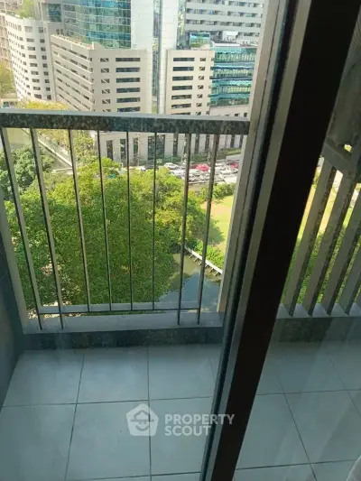 Urban balcony view with cityscape and greenery, perfect for modern living.