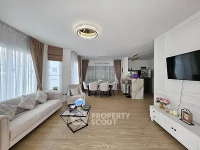 Spacious modern living room with elegant decor and open dining area