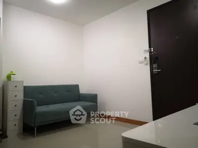Modern minimalist living room with sleek sofa and storage unit
