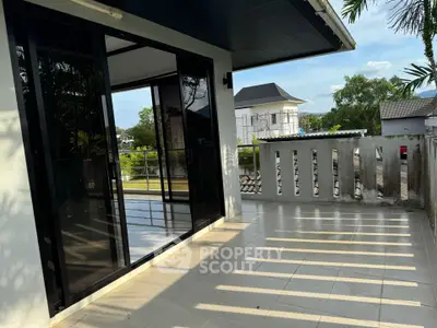 Spacious balcony with modern glass doors and scenic view