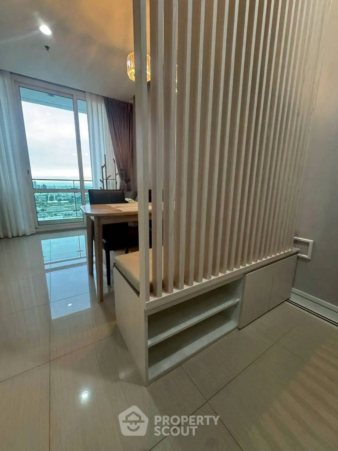 Modern living room with elegant partition and stunning balcony view