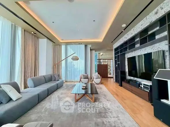 Luxurious modern living room with elegant decor and large windows