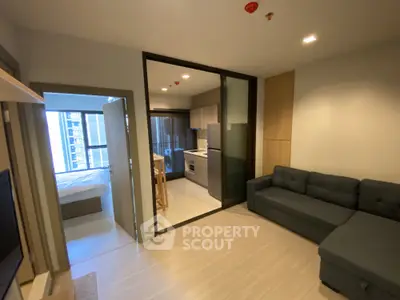 Modern open-plan living room with kitchen and bedroom in a stylish apartment