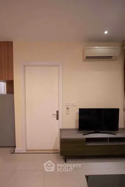 Modern living room with air conditioning and sleek TV setup