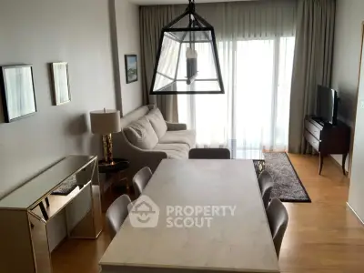 Spacious living room with modern decor and large windows for natural light.