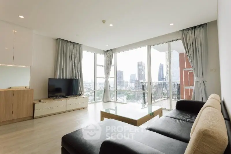 Spacious modern living room with city view and large windows
